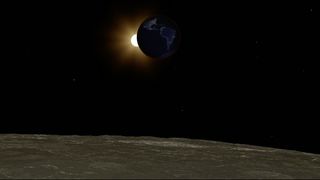 lunar eclipse from the surface of the moon. Earth is partially blocking light from the sun in the background.