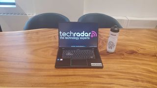 black chromebook on wooden desk