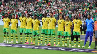 The Jamaica men&#039;s national soccer team lineup on the pitch ahead of the Jamaica vs Canada quarter-final second leg 