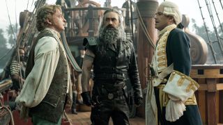 Taika Waititi's Blackbeard stands between two other sailors in HBO Max show Our Flag Means Death