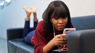 Woman watching YouTube on phone