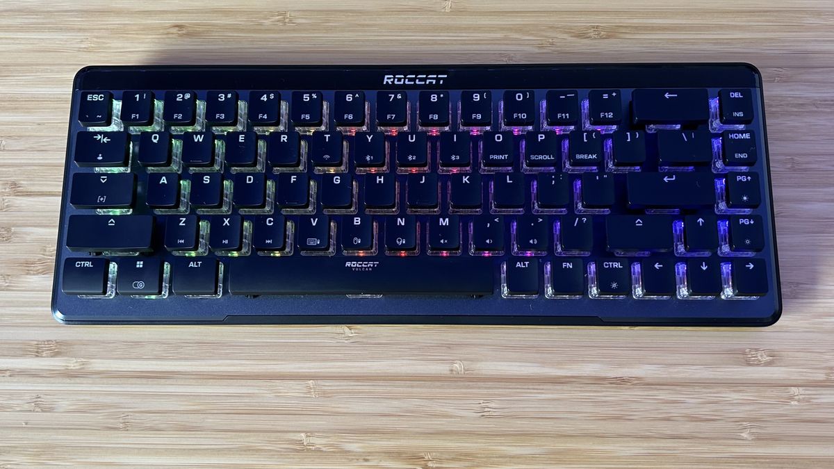 Roccat Vulcan II Mini Air gaming keyboard on a wooden desk 