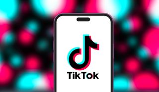 A phone showing the TikTok logo