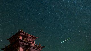 A meteor streaks across the sky during the Perseid meteor shower.