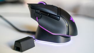 Razer Basilisk V3 Pro with Mouse Dock Pro on a white table