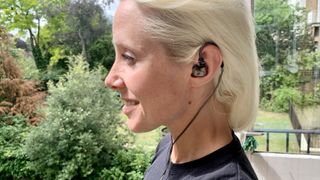 Sennheiser IE 600 worn on a balcony by TechRadar's Becky Scarrott