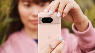 Google Pixel 8 Rose handheld lifestyle press image