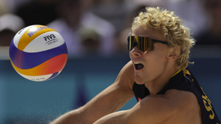 Sweden's #01 David Ahman digs the ball ahead of the Sweden vs Germany Men's Beach Volleyball final at Olympics 2024