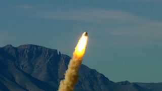 Blue Origin’s pusher escape system rockets the Crew Capsule away from the launch pad, demonstrating a key safety system for both suborbital and orbital flights. Image released Oct. 22, 2012.