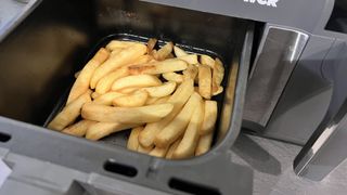 Cooked chips in the basket of the Tower Vortx Eco Duo air fryer