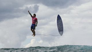 Viral photo of surfer Gabriel Medina alongside surfboard in the air at 2024 Olympics