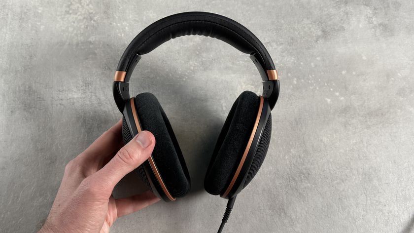 The Sennheiser HD 505 headphones held in a man&#039;s hand