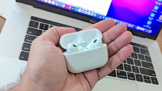 Apple AirPods Pro 2 in hand of reviewer 