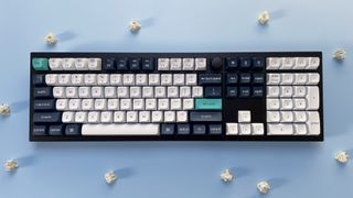 The Keychron Q6 Max mechanical keyboard against a blue background.