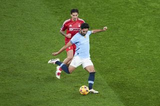 Manchester City player Ilkay Gundogan kicking ball during Premier League match