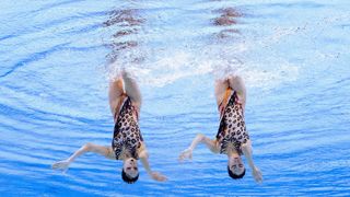 Team China, in leopard print swim suits, perform a duets routine in the synchronized swimming ahead of the 2024 Paris Olympic Games.