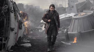 Cassian Andor walks through a scrapyard in his self-titled Star Wars Disney Plus show