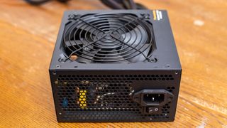 A power supply unit on a wooden table