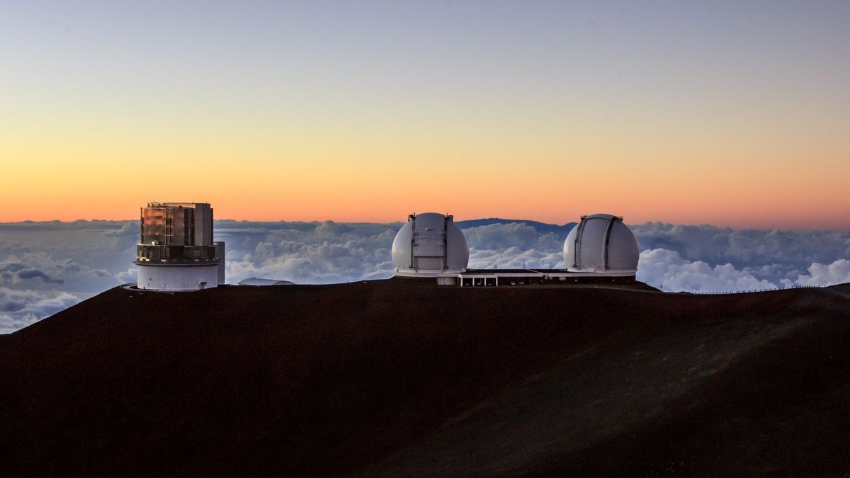 The Subaru Telescope and the twin domes of the Keck Observatory atop Maunakea in Hawaii.