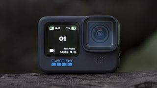 The GoPro Hero 11 Black action camera sitting on a wooden platform