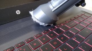 A vacuum over a laptop