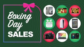 Assorted tech products on green background with boxing day sales text overlay