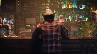 Wolverine sitting in a bar, his back is facing the screen