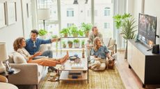 family watching tv on the floor 