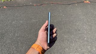 The side profile of the Motorola Edge 50 Fusion on a dark background