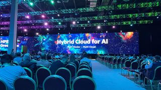 "Hybrid Cloud for AI" on the backing screen of the keynote stage at the Venetian Conference Center during HPE Discover 2024