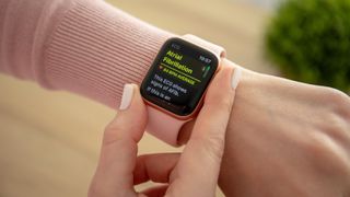 Woman using ECG app on Apple Watch