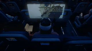 A Vision Pro user watching a pirate film while in an airplane seat