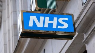 NHS logo pictured outside a pharmacy in London.