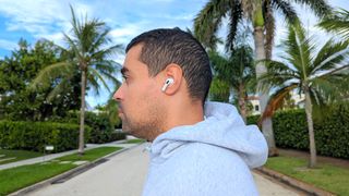 Reviewer wearing Apple AirPods Pro 2 on a run