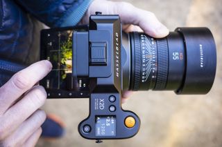 The Hasselblad X2D 100C camera with touchscreen flipped out