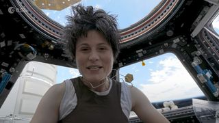 European space Agency astronaut Samantha Cristoforetti floats in weightlessness dressed as actor Katee Sackhoff's Starbuck from Battlestar Galactica on the International Space Station in July 2022.