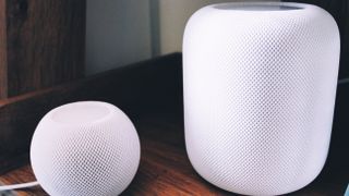 Black HomePod 2 alongside White HomePod 2