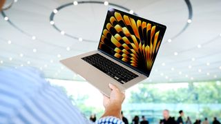 A person holding the 15-inch MacBook Air at Apple's Worldwide Developers Conference (WWDC) in 2023.