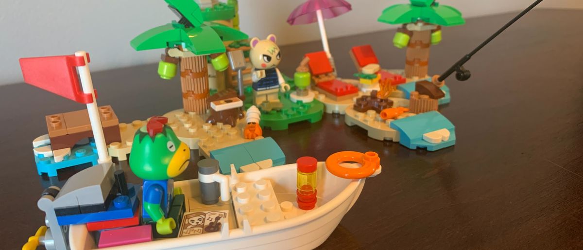 Lego Kapp&#039;n&#039;s Island Boat Tour set laid out on a wooden table