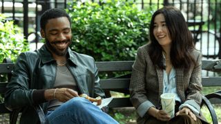 John and Jane Smith laughing together on a bench.