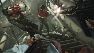 Wolfenstein 2: The New Colossus screenshot of a gunfight taking place on a staircase.