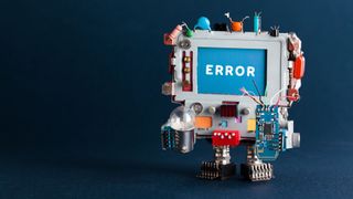 Toy robotic computer with light bulb and broken circuit on dark blue background. Text message Error on blue screen.