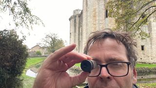 man using a monocular