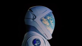 a white spacesuit with the reflection of earth on the visor