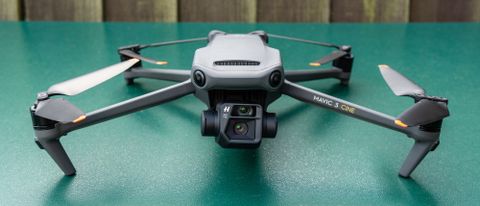 The DJI Mavic 3 drone sitting on a green surface