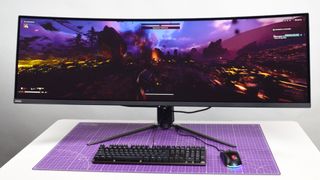 An MSI MPG 491CQP QD-OLED on a desk playing Helldivers 2