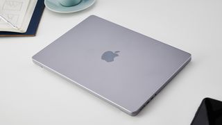 MacBook Pro 14-inch on a table in an office