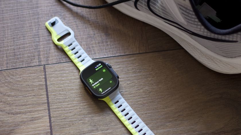 Apple Watch Ultra 2 showing an outdoor walk workout alongside a trainer