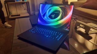 The Razer Blade 16 (2025) on a glass table in a hotel suite at CES 2025.