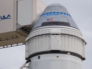 Boeing’s CST-100 Starliner spacecraft sits atop a United Launch Alliance Atlas V rocket at Cape Canaveral Space Force Station in Florida ahead of the planned launch of its Orbital Flight Test 2 mission to the International Space Station. That launch was scheduled to occur on Aug. 3, 2021, but issues with valves in Starliner’s service module have pushed it into the first half of 2022.